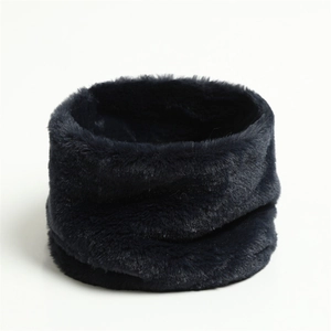 Close-up of dark blue faux rabbit fur neck warmer with soft plush texture on white background