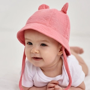 Pink cotton baby bucket hat detail with cute 3D bunny ears and textured fabric finish