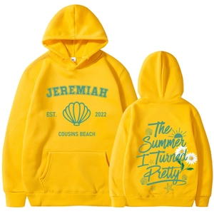 Flat lay of bright yellow hooded sweatshirt with summer themed front and back prints