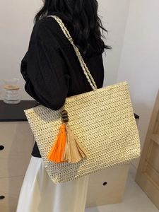 Large rainbow striped straw tote bag with tassels for beach vacation and daily use