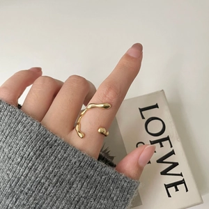 Irregular organic flow gold open ring with liquid metal texture on finger