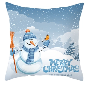 Detail of Christmas pillow cover featuring a snowman and winter scene illustration