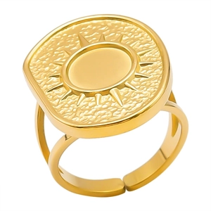 Detail of adjustable gold sunburst signet ring with textured rectangular face