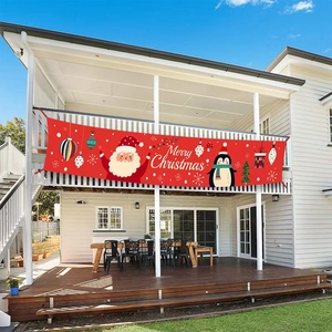 Outdoor red Merry Christmas banner hanging on white balcony fence for festive decor