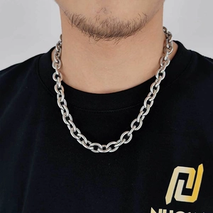 Classic 12mm silver stainless steel cross chain necklace shown on a male model with white background