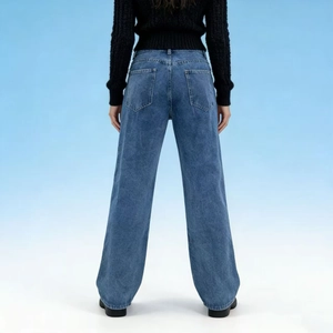 Detail view of high waist loose wide leg jeans with double back pockets and washed texture