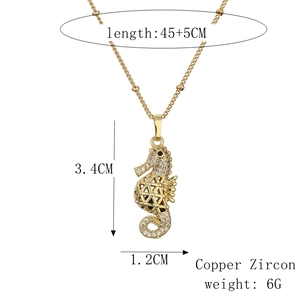 Detail view of gold seahorse pendant necklace with exact size and weight measurements