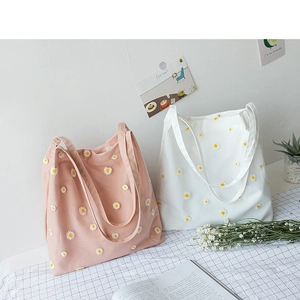 Chic canvas tote bags with daisy floral embroidery in pink and white for daily use