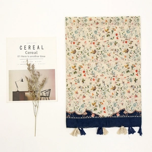 Floral print cotton linen scarf with tassel fringe and wavy embroidery details