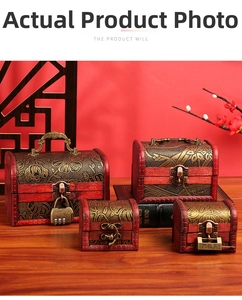 Detail of vintage wooden jewelry boxes with golden floral embossing and metal clasps