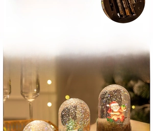 Detailed view of Christmas snow globe lamp featuring Santa and a red car with warm LED light