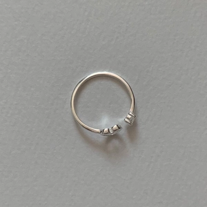 Macro shot of S925 sterling silver open ring with two sparkling zircon stones