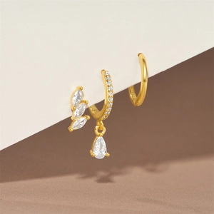 Detailed macro view of S925 sterling silver gold-plated earring set with zircon