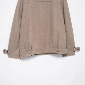 Brown wool bomber jacket with stand-up collar showing elastic hem and ribbed cuff detail