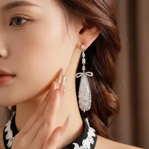 Elegant silver tassel earrings with zircon bow and pear-shaped droplet pendant for women