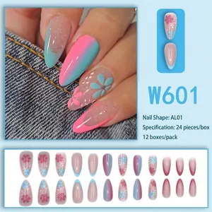 Blue and pink gradient press-on nails with floral patterns and silver glitter sparkle