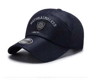Detail of navy blue mesh baseball cap with white Natural Walker embroidery and shield badge