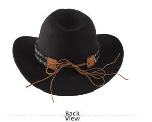 Detail of black cowboy hat featuring ethnic patterned band and brown leather tassels