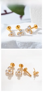 Detailed views of gold titanium labret studs featuring three round cubic zirconia stones
