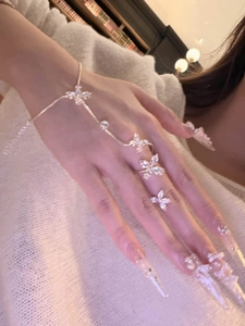 Elegant French zircon butterfly hand chain bracelet with ring detail on model's hand