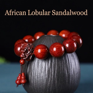 Bracelet en bois de santal africain avec dragon sculpté et pendentif de calebasse