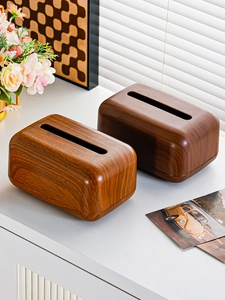 Close-up of walnut wood grain tissue box on a bright table with minimalist decor