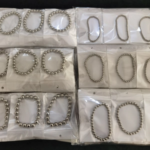 Batch view of minimalist stainless steel ball bead bracelets in a neat grid display