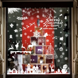 White Christmas window decals featuring Santa, reindeer and snowman decorations