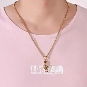 Golden hip-hop music note treble clef pendant with box chain worn on model