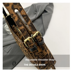 Detail of leopard print bag showing adjustable shoulder strap with gold metal buckle