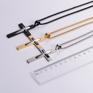 Vintage stainless steel cross necklaces in black, gold and silver finishes with scale