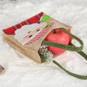 Christmas burlap gift bag with Santa Claus pattern, decorated with red apples and pine cones