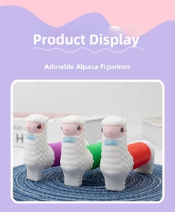 Three colorful llama pop tube sensory toys standing on a woven mat for tactile play