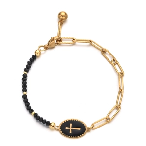 Detail of cross pendant and black faceted beads on gold paperclip chain bracelet