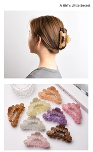Macro detail of high-end rhinestone-studded hollow hair claw clips in various colors