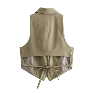 Detail view of the khaki vest featuring an open-back design with adjustable lacing and ties