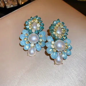 Vintage floral pearl earrings with blue crystals and gold setting for elegant women