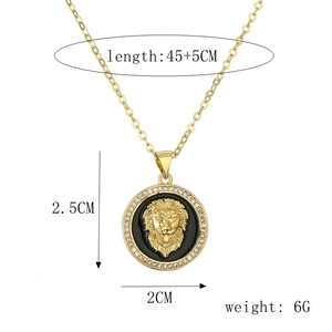Detailed gold lion medallion pendant with black enamel and sparkling zircon accents