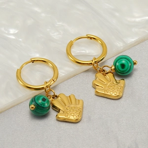 Golden titanium steel earrings featuring green turquoise beads and hand-shaped pendants