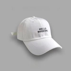 Close-up of HELLO WEEKEND embroidery on a white cotton baseball cap with a curved brim
