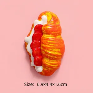 Detailed view of DIY resin croissant fridge magnet accessory with jam and cream 6.9cm