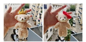 Detail of plush bear keychains with golden crown and red bow decoration in soft cream fabric