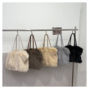 Detailed display of five plush tote bags in cream, brown, khaki, grey, and black
