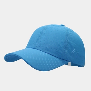 Detail of royal blue baseball cap featuring breathable laser-cut micro-perforated fabric