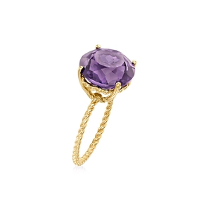 Detail of s925 silver ring featuring a round purple gemstone and twisted gold band