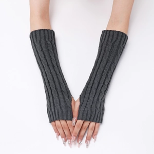 Detailed macro view of dark grey cable knit pattern on long fingerless gloves arm warmers
