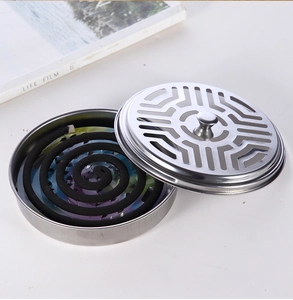 Detailed top view of a stainless steel mosquito coil holder with maze pattern cutout lid