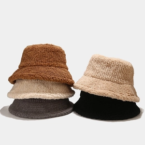Thick plush winter bucket hats shown in caramel, beige, grey, cream, and black colors