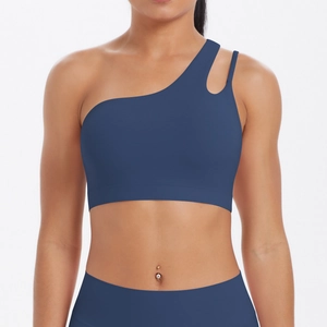 Detail of navy blue one-shoulder sports bra with cutout strap and brushed fabric