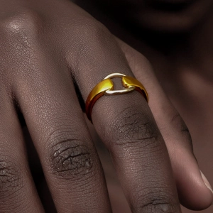 Minimalist 18K gold plated stainless steel horsebit ring on a model hand